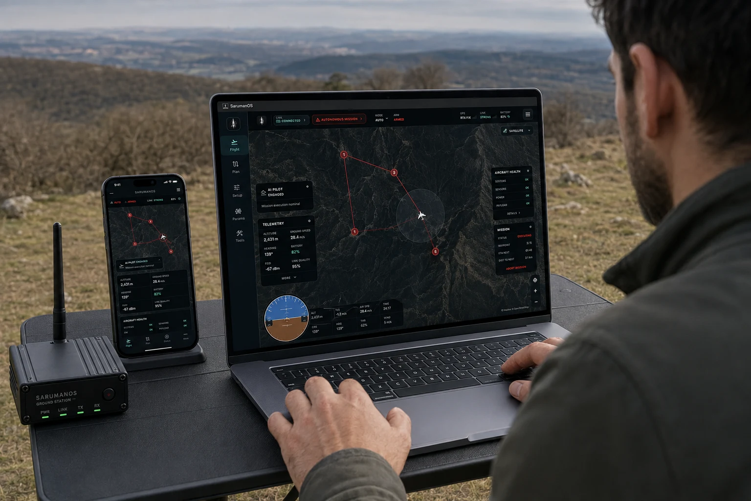Operator concept showing the SarumanOS dark mission map on a laptop and phone beside a portable ground station